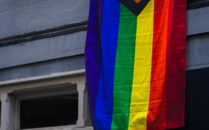 red yellow blue and purple flag by Jack Lucas Smith courtesy of Unsplash.