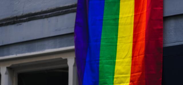red yellow blue and purple flag by Jack Lucas Smith courtesy of Unsplash.